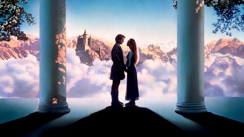 couple on a balcony with castle
