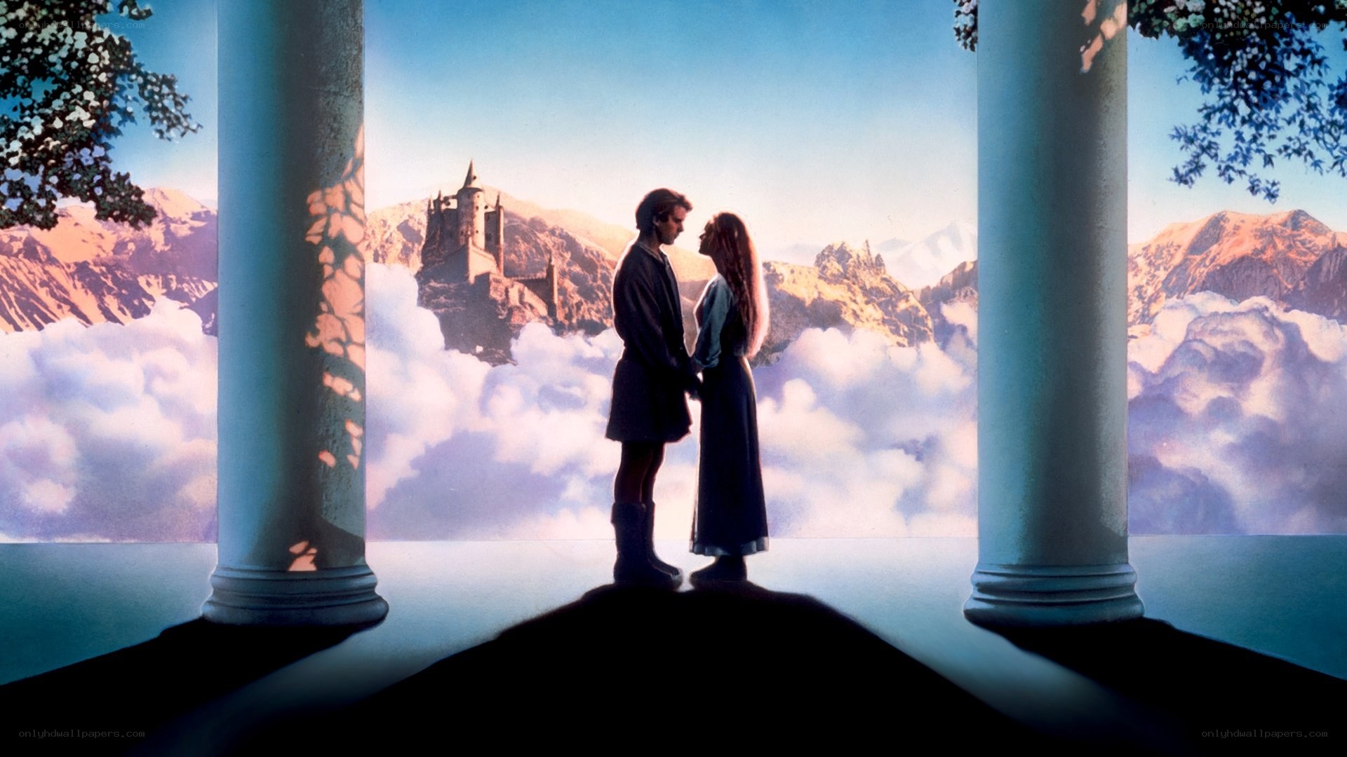 couple on a balcony with castle
