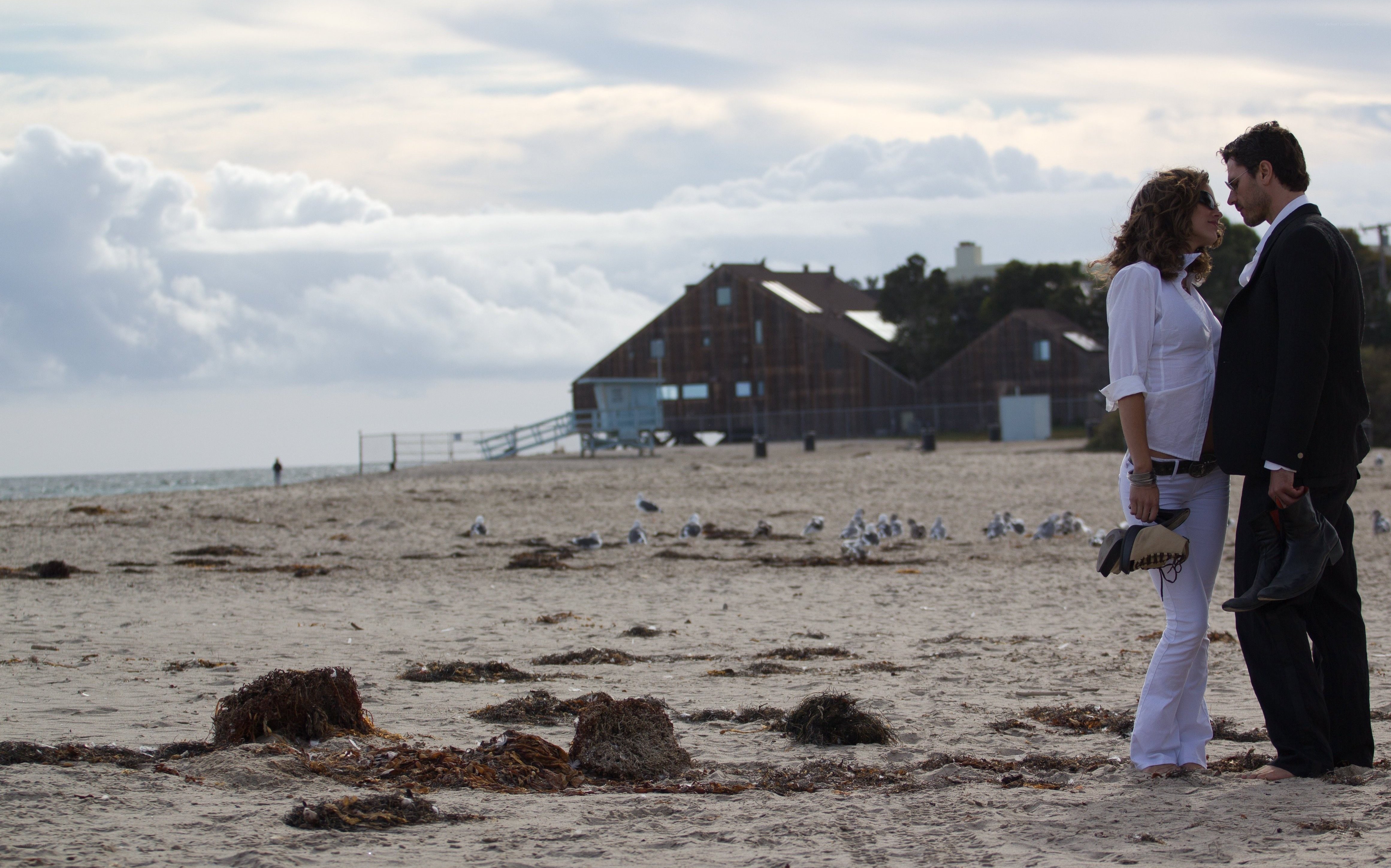 Couple on a beach at dusk