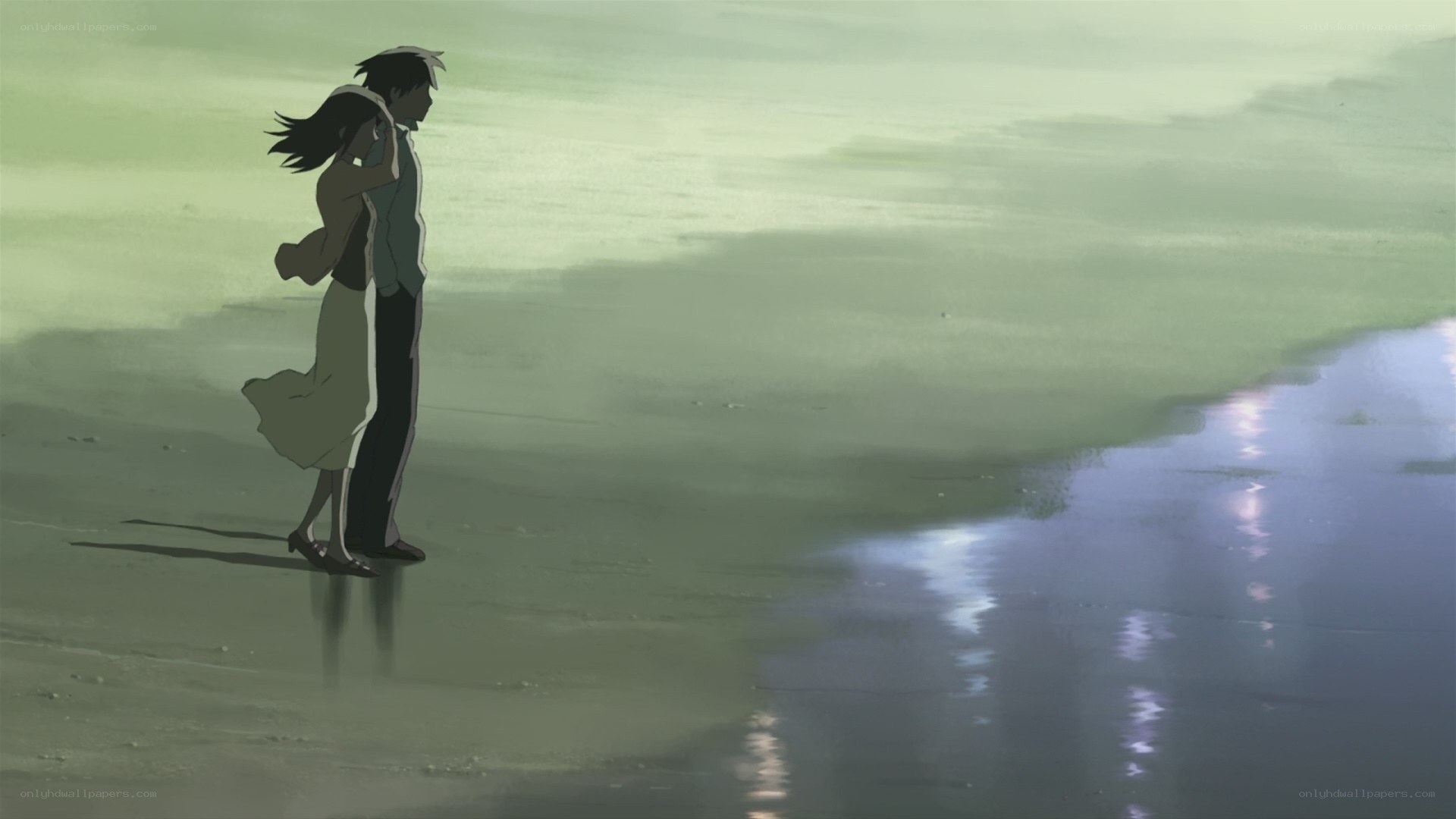 couple on a beach at dusk
