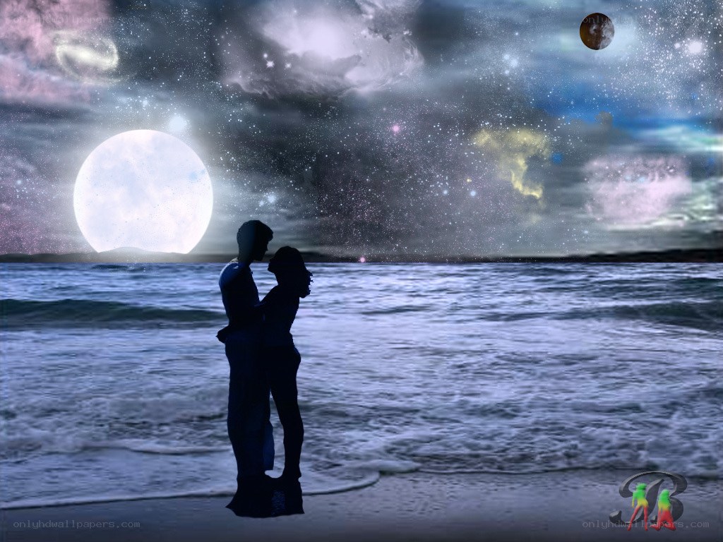 Couple on a beach at night