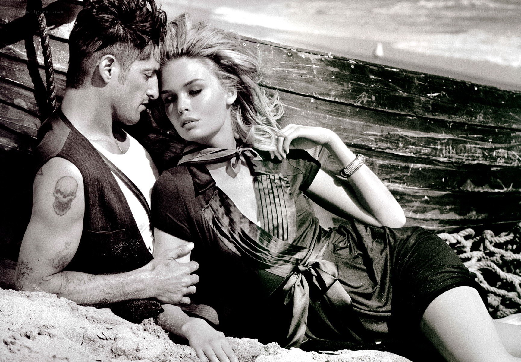 Couple on a beach at sunset