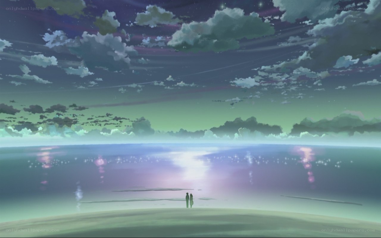 couple on a beach at twilight