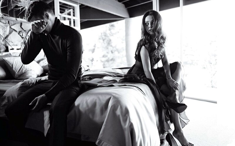Couple on a bed in black and white