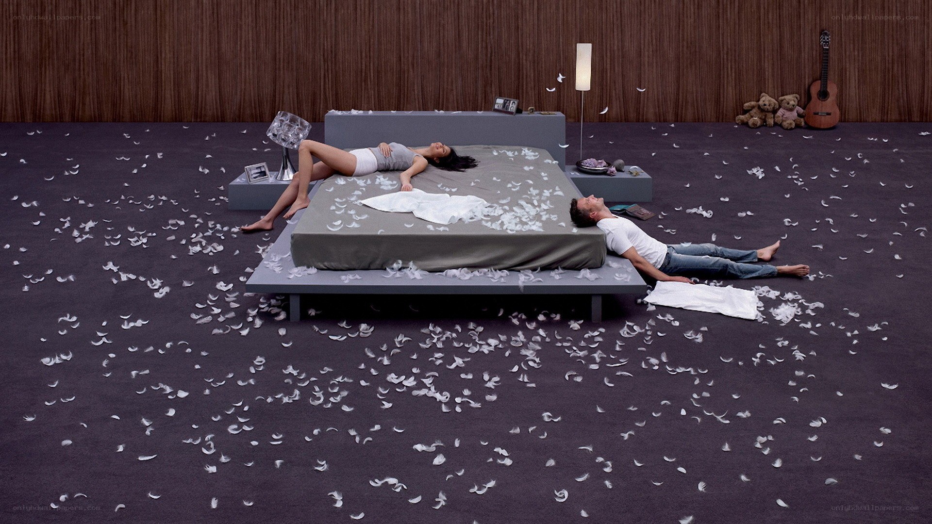 Couple on a bed with feathers