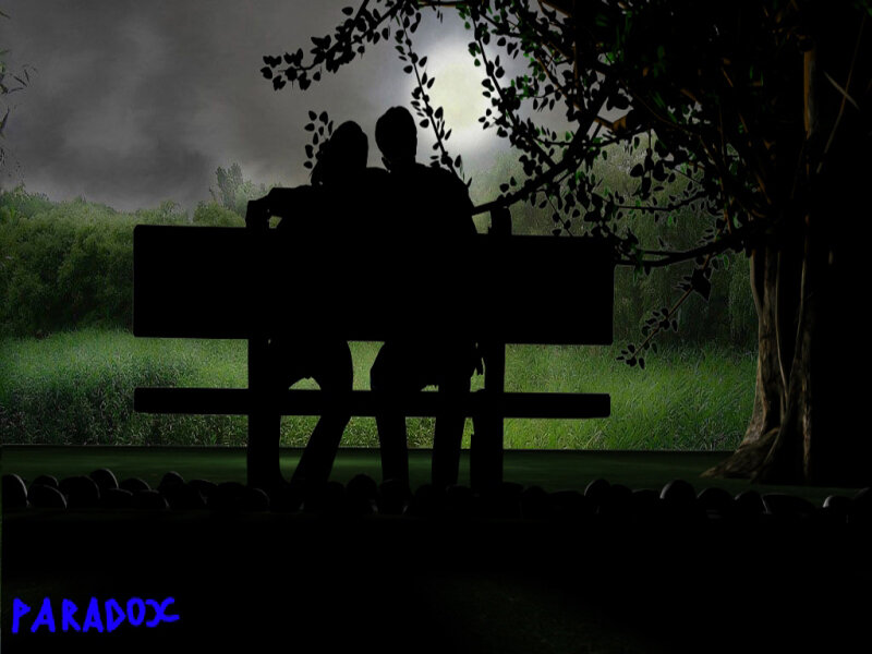 Couple on a bench at night