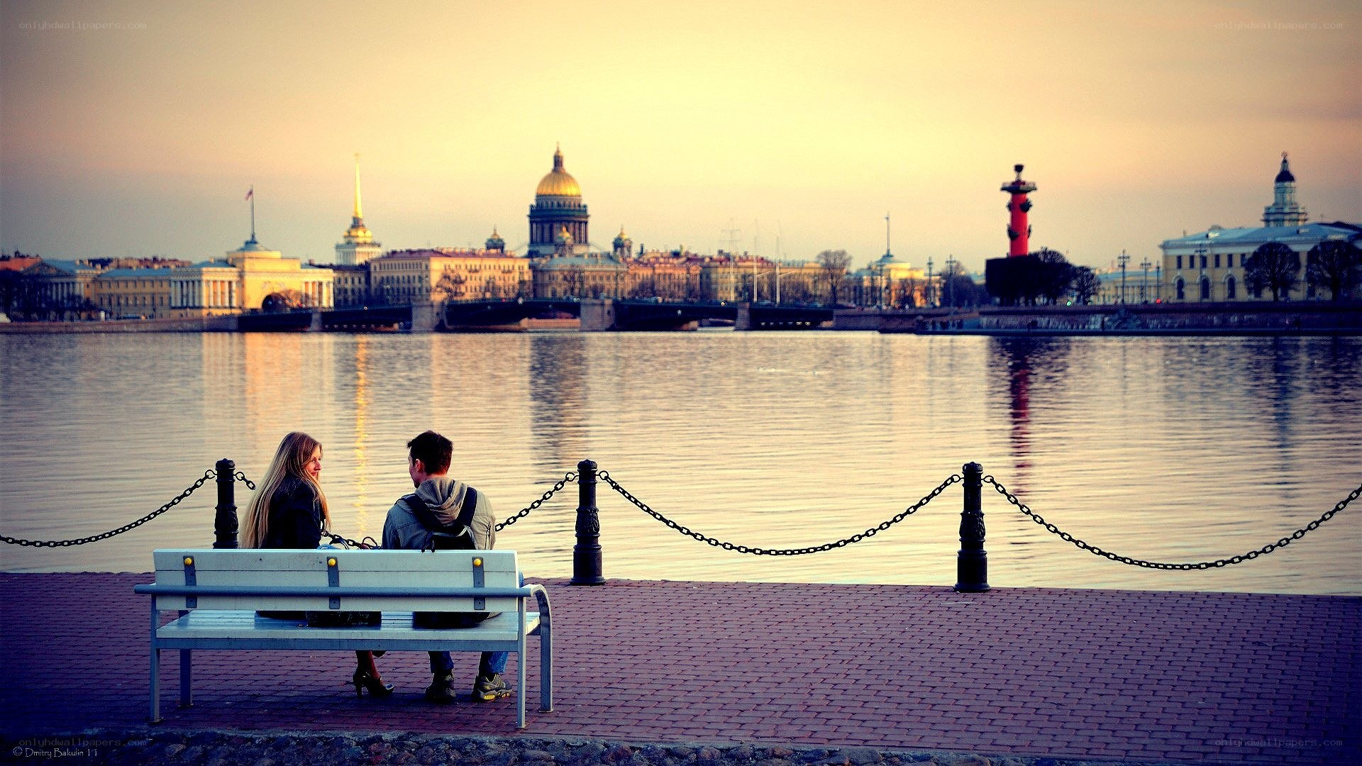 Couple on a bench at sunset