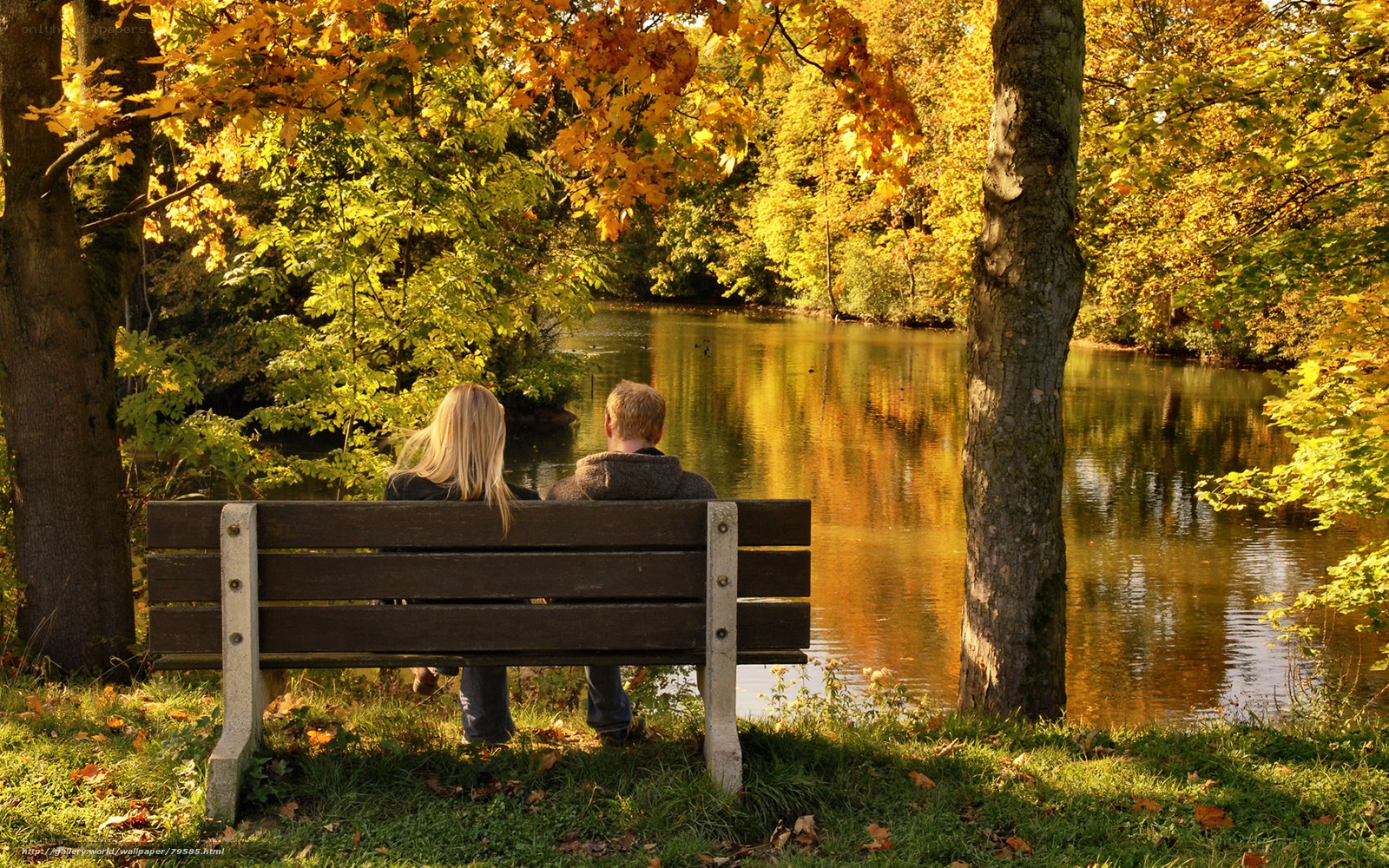 Couple on a bench by a lake
