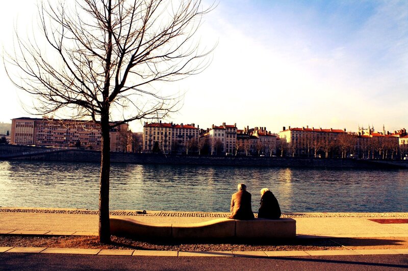 Couple on a bench by the river