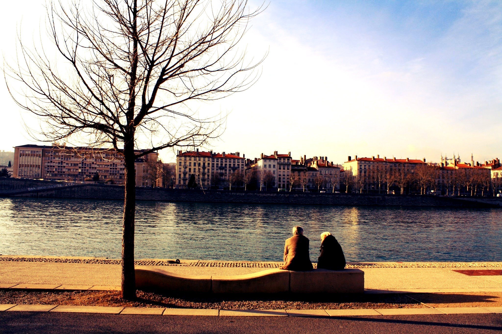 Couple on a bench by the river