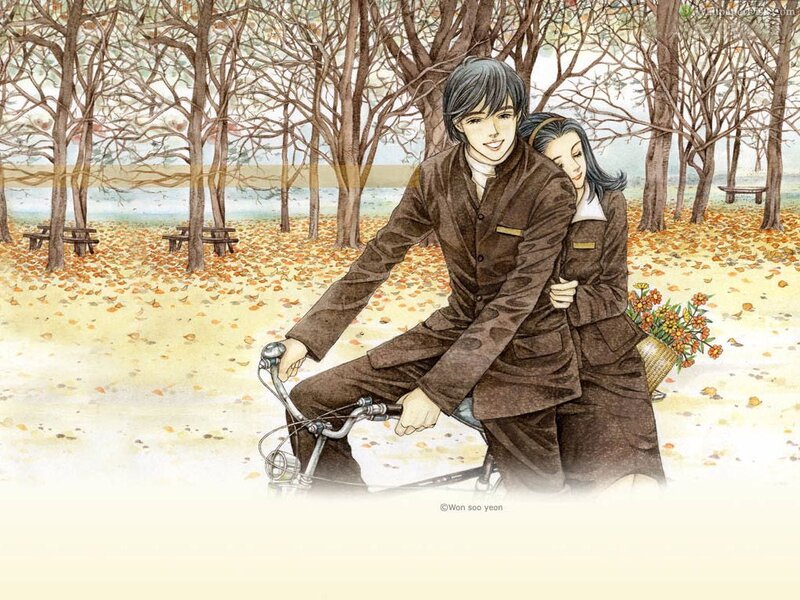Couple on a bicycle in autumn
