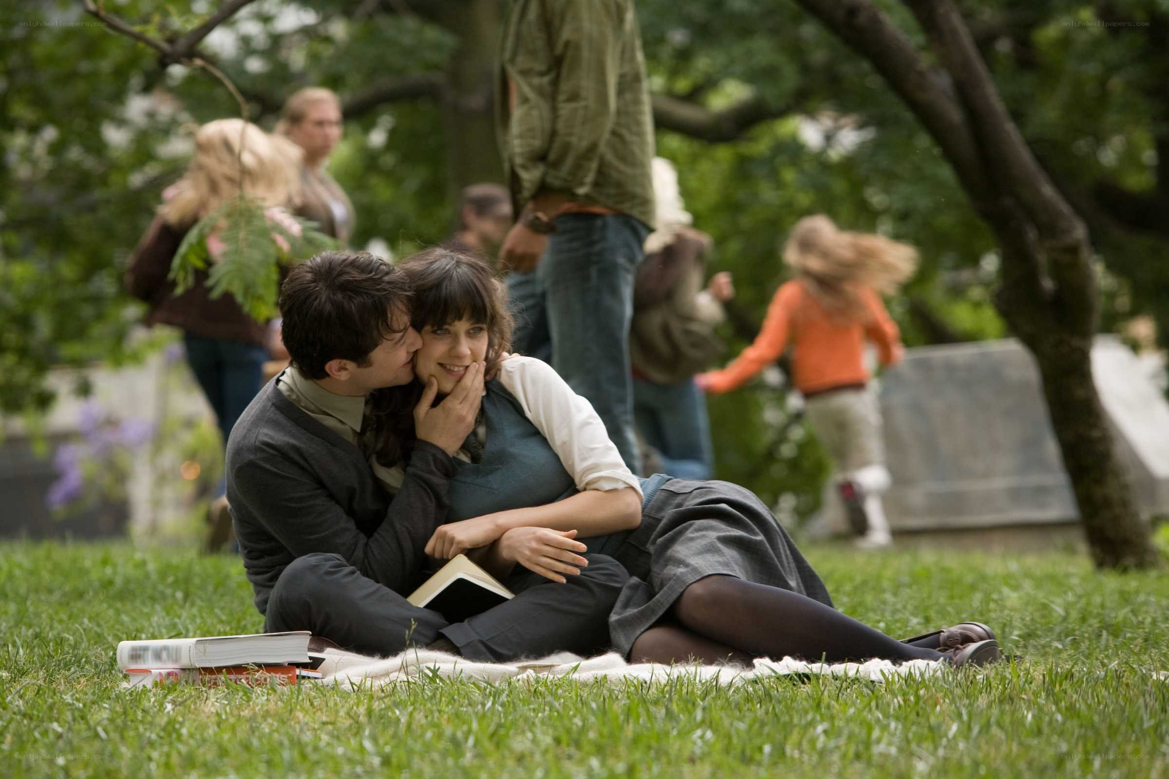 Couple on a blanket in park