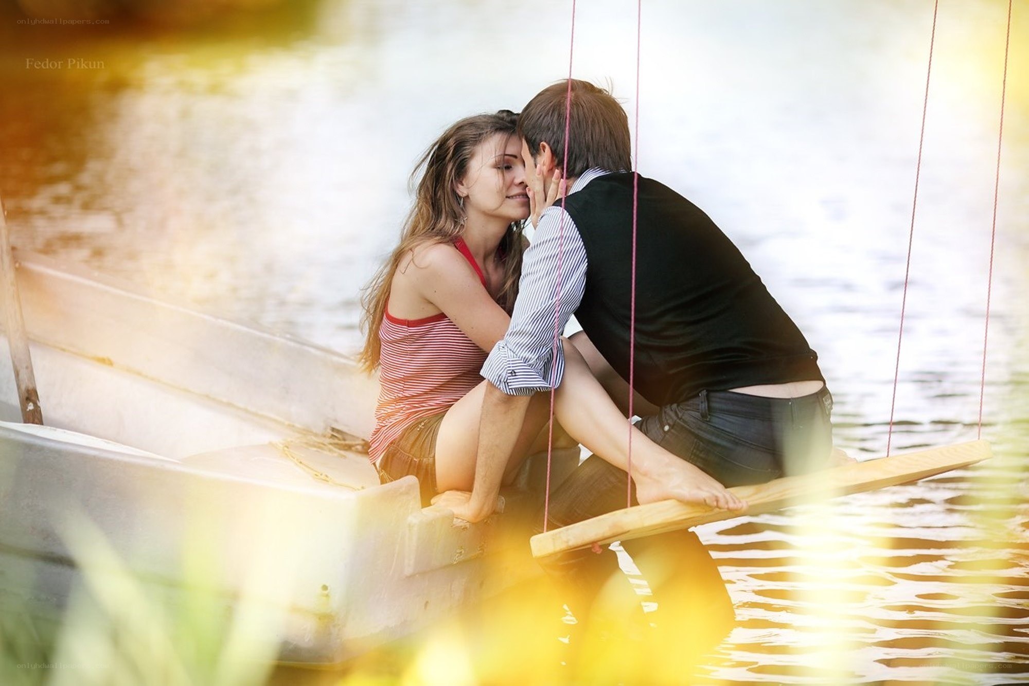 Couple on a boat at sunset