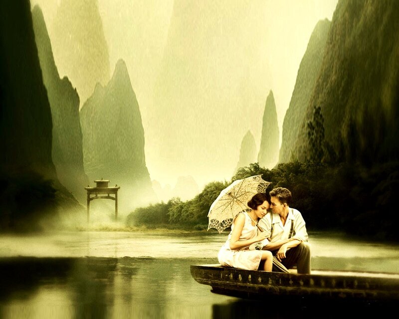 Couple on a boat in misty landscape