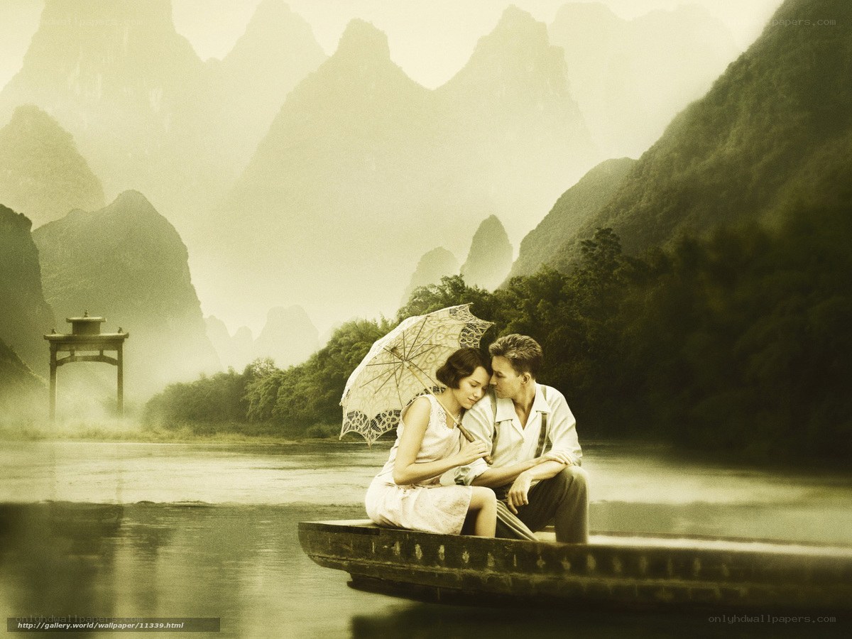 Couple on a boat in misty landscape