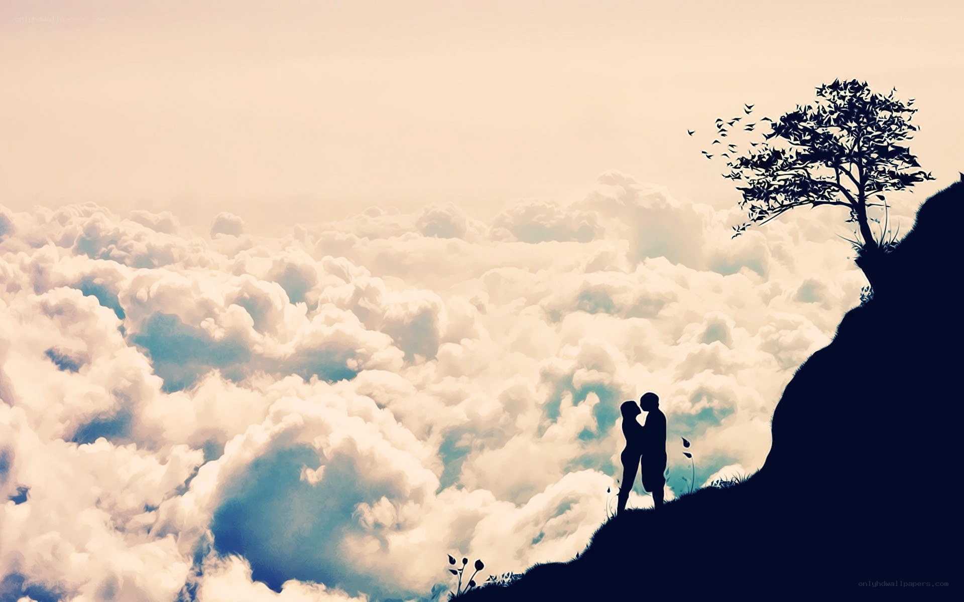 couple on a cliff above clouds