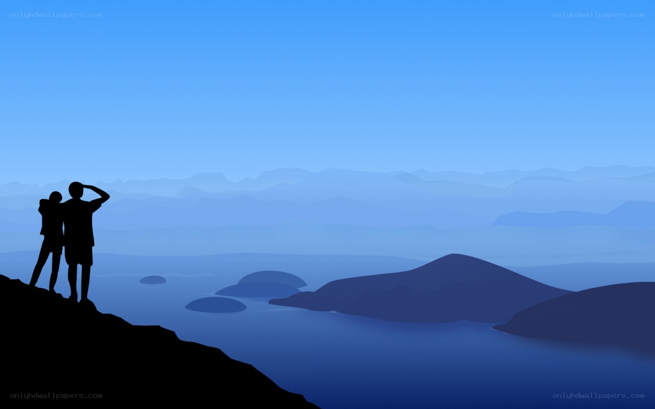 couple on a cliff overlooking the sea