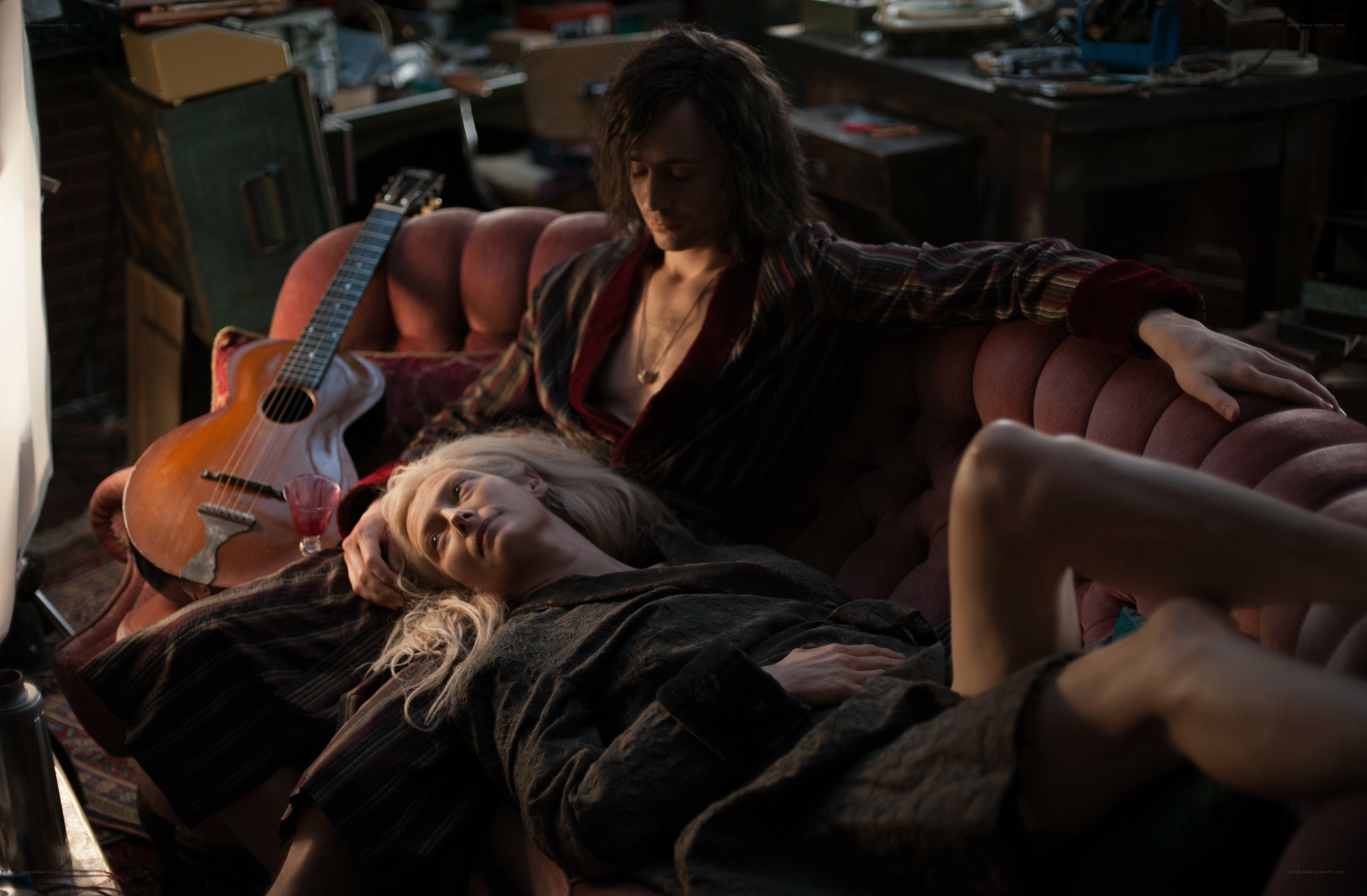 Couple on a couch with guitar