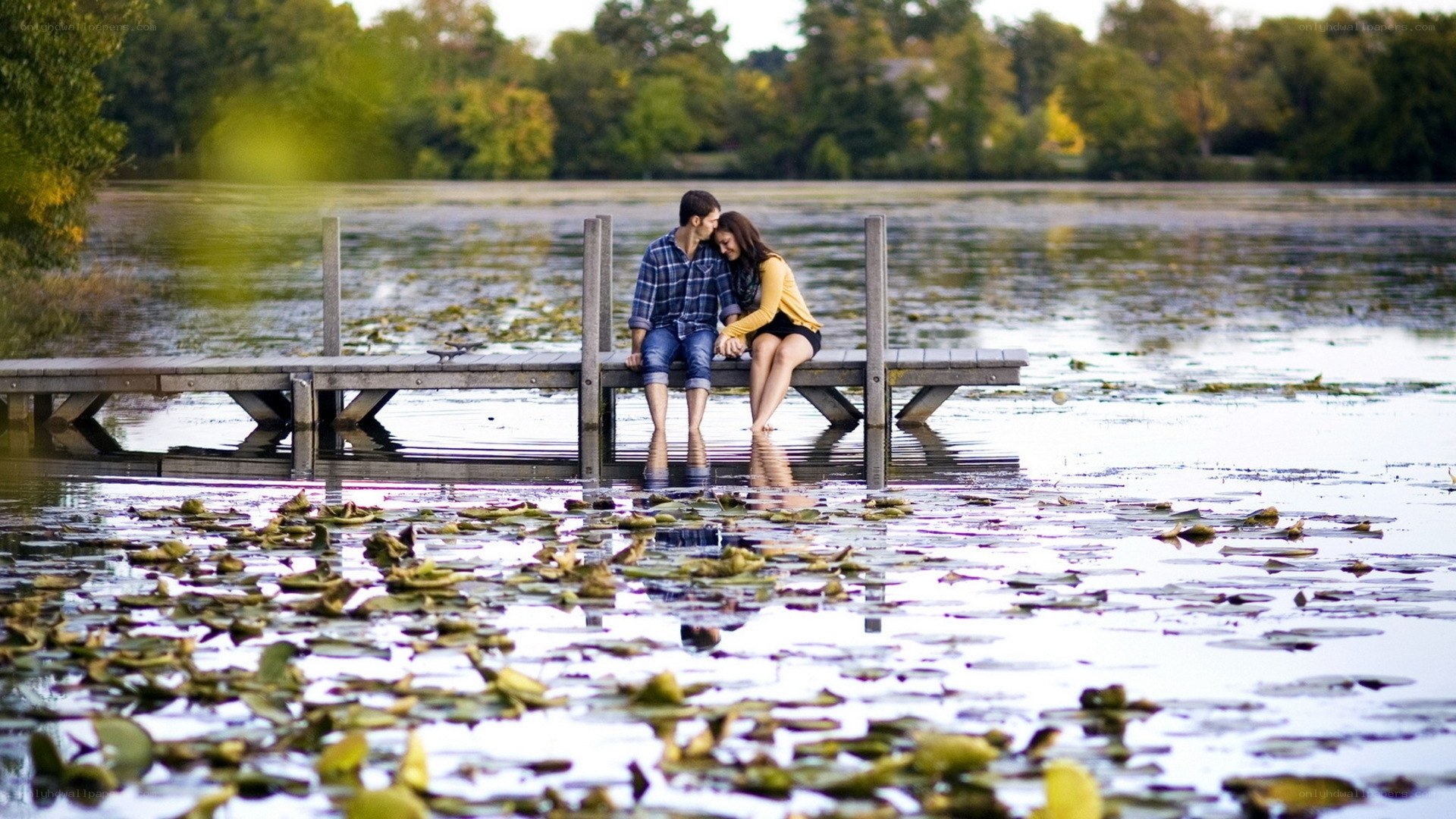 Couple on a dock at a lake