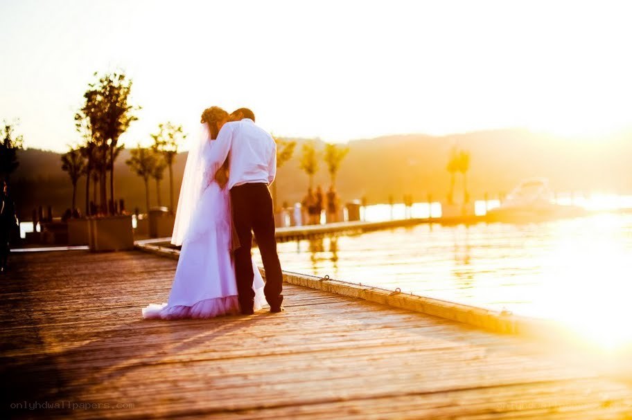 Couple on a dock at sunset