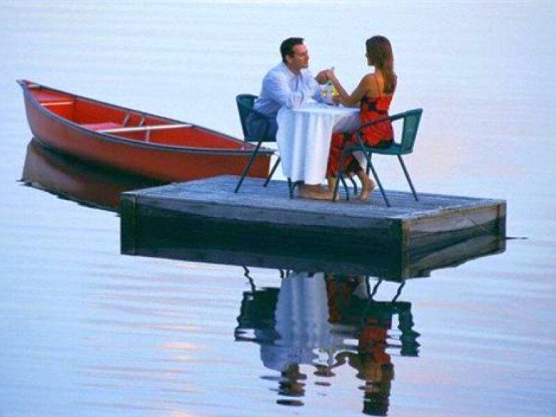 Couple on a dock at sunset