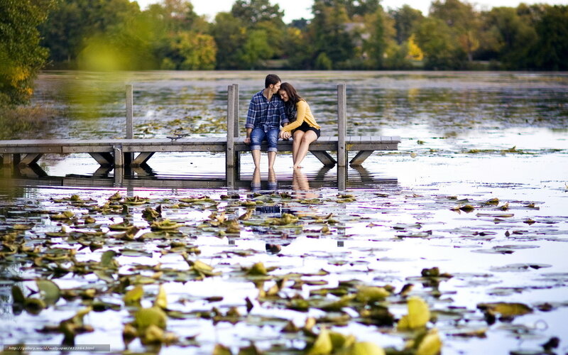 Couple on a dock by a lake