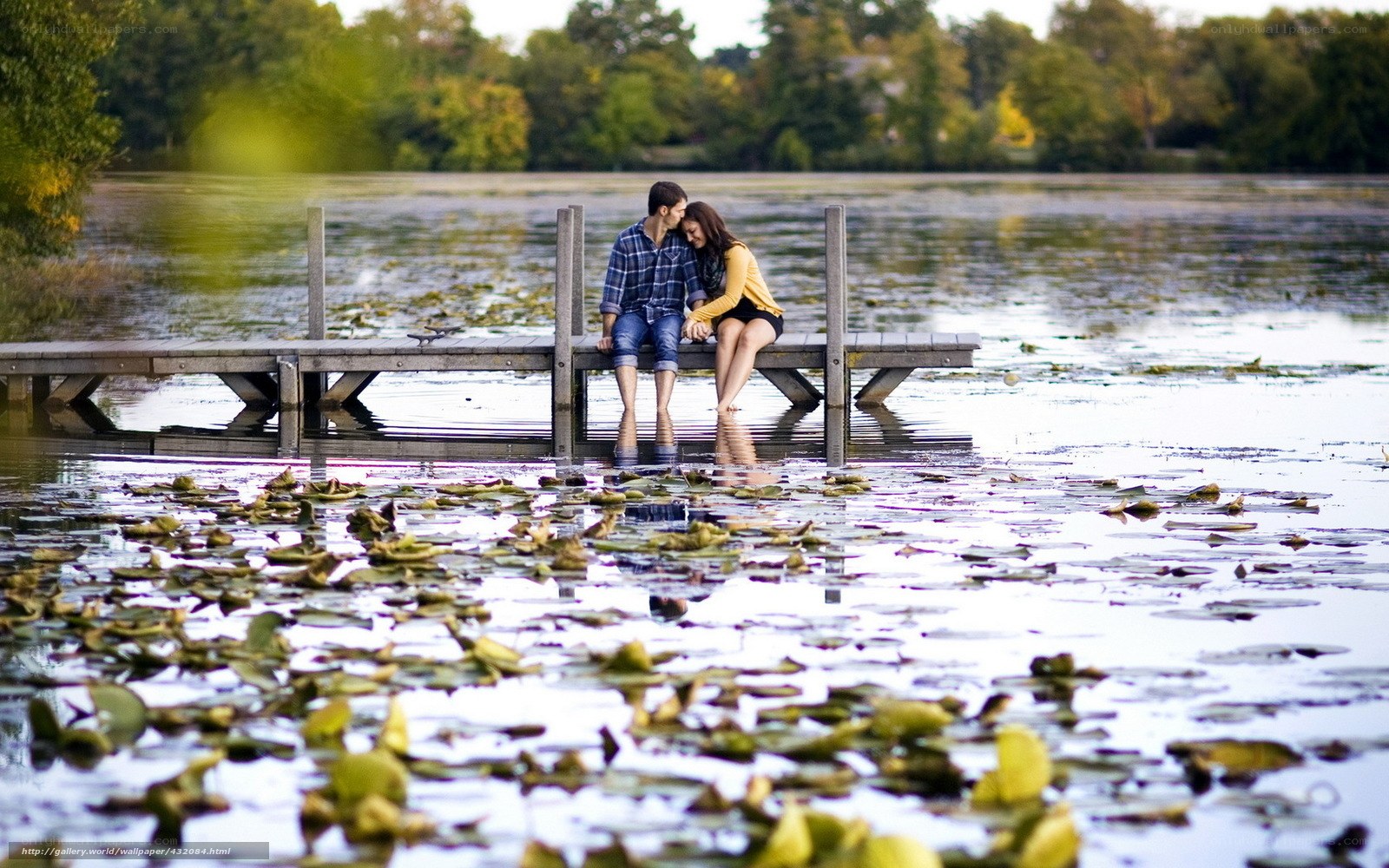 Couple on a dock by a lake