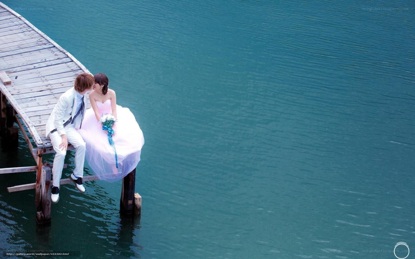 Couple on a dock by the water