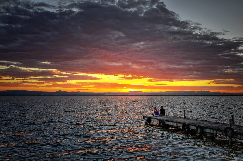 Couple on a Dock — Orange, Dramatic