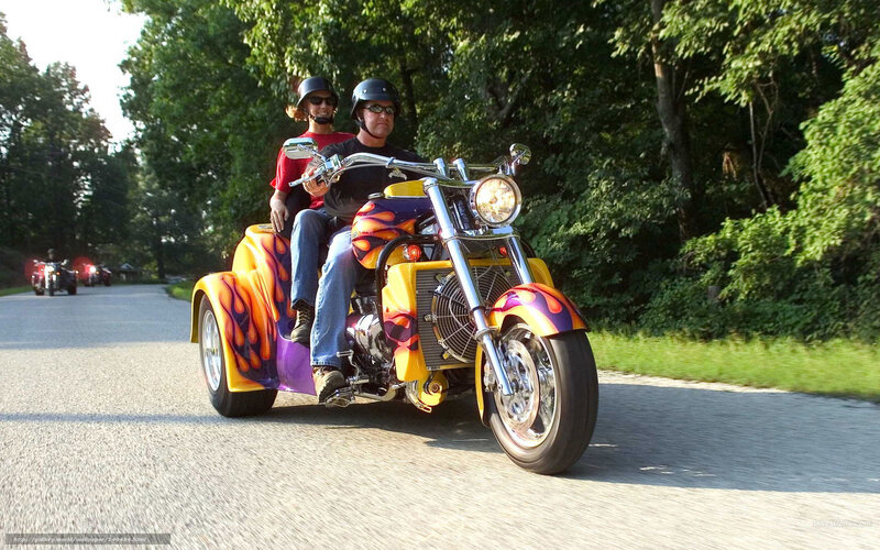 Couple on a flame-painted trike