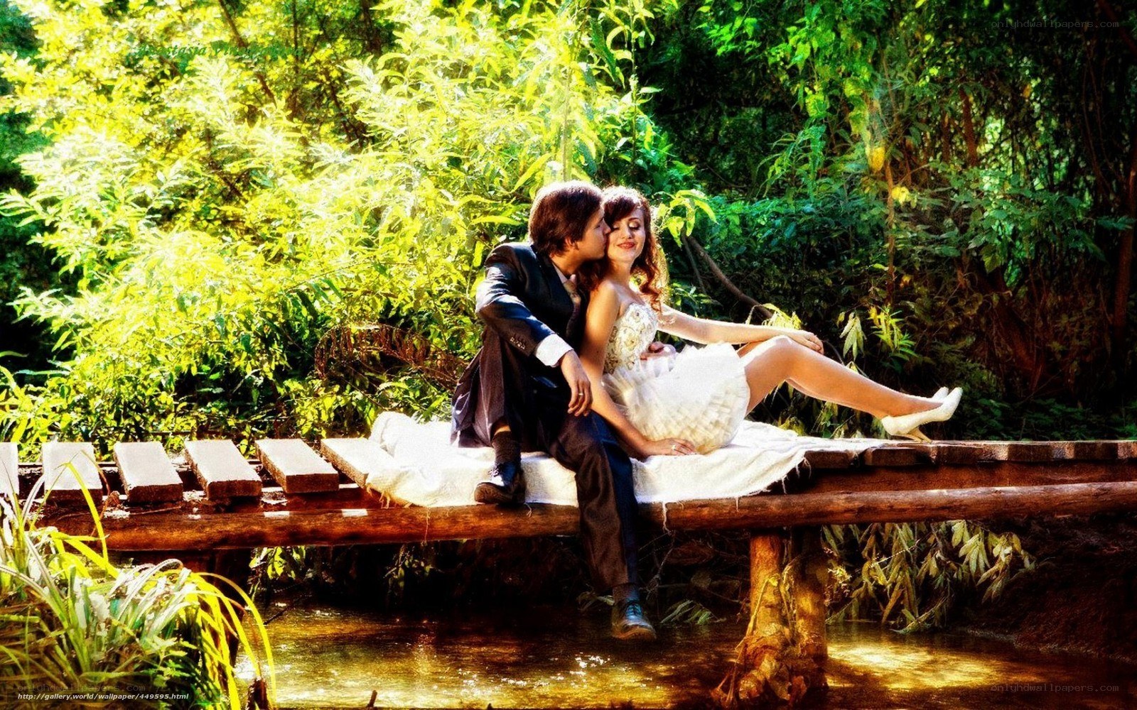 Couple on a forest bridge