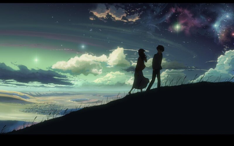 couple on a hill at night