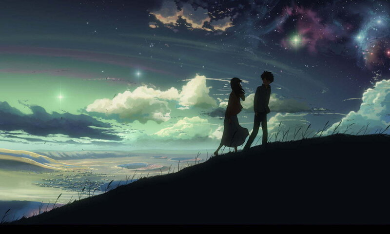 couple on a hill at night