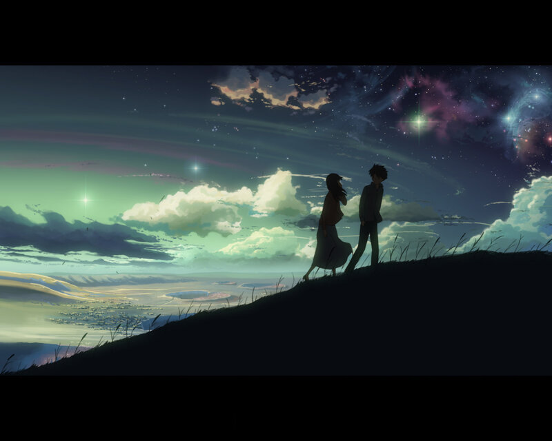 couple on a hill at night