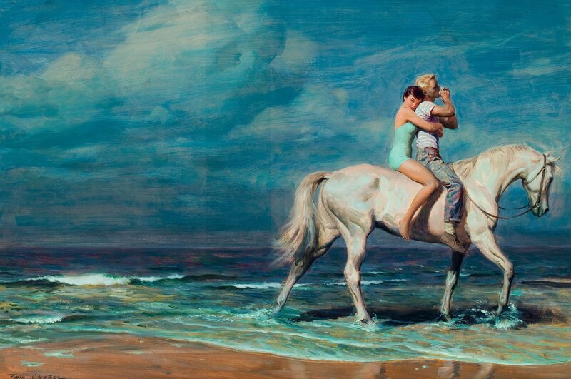 Couple on a horse at the beach