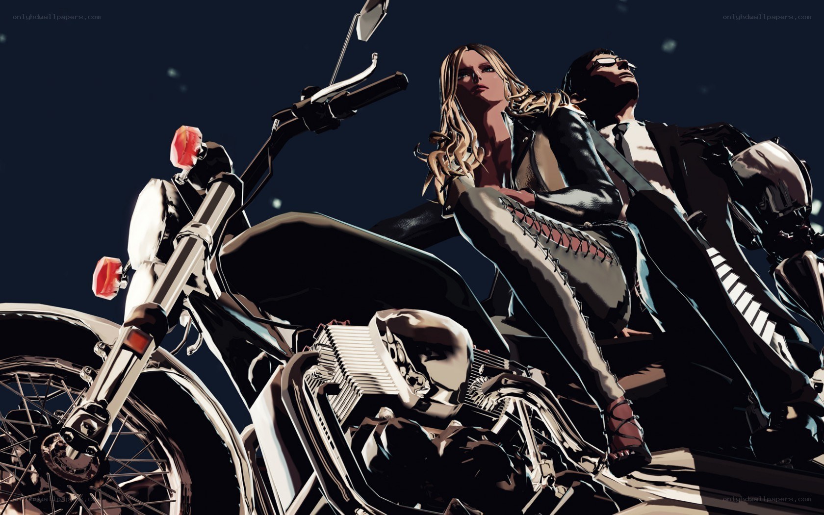 Couple on a motorcycle at night