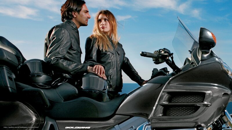 Couple on a motorcycle by the sea