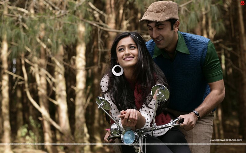 Couple on a motorcycle in the woods