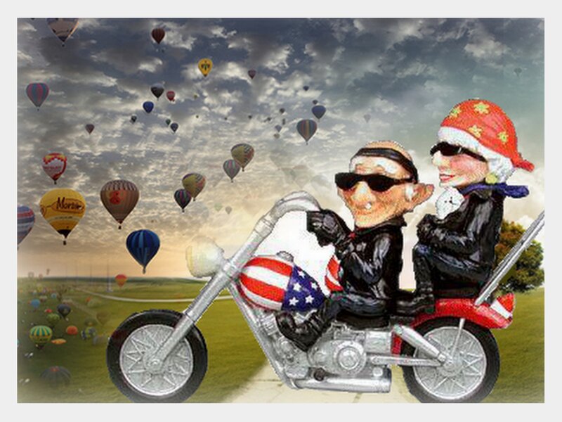 Couple on a motorcycle with hot air balloons