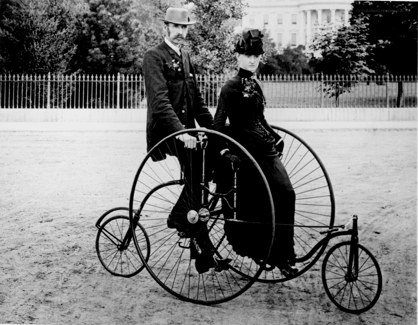 Couple on a penny-farthing bicycle