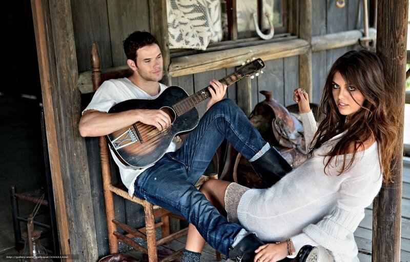 Couple on a porch with guitar