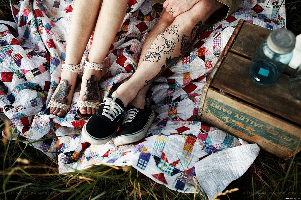 Couple on a quilted blanket