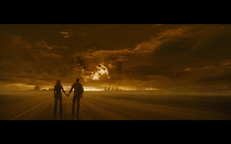 couple on a road at sunset