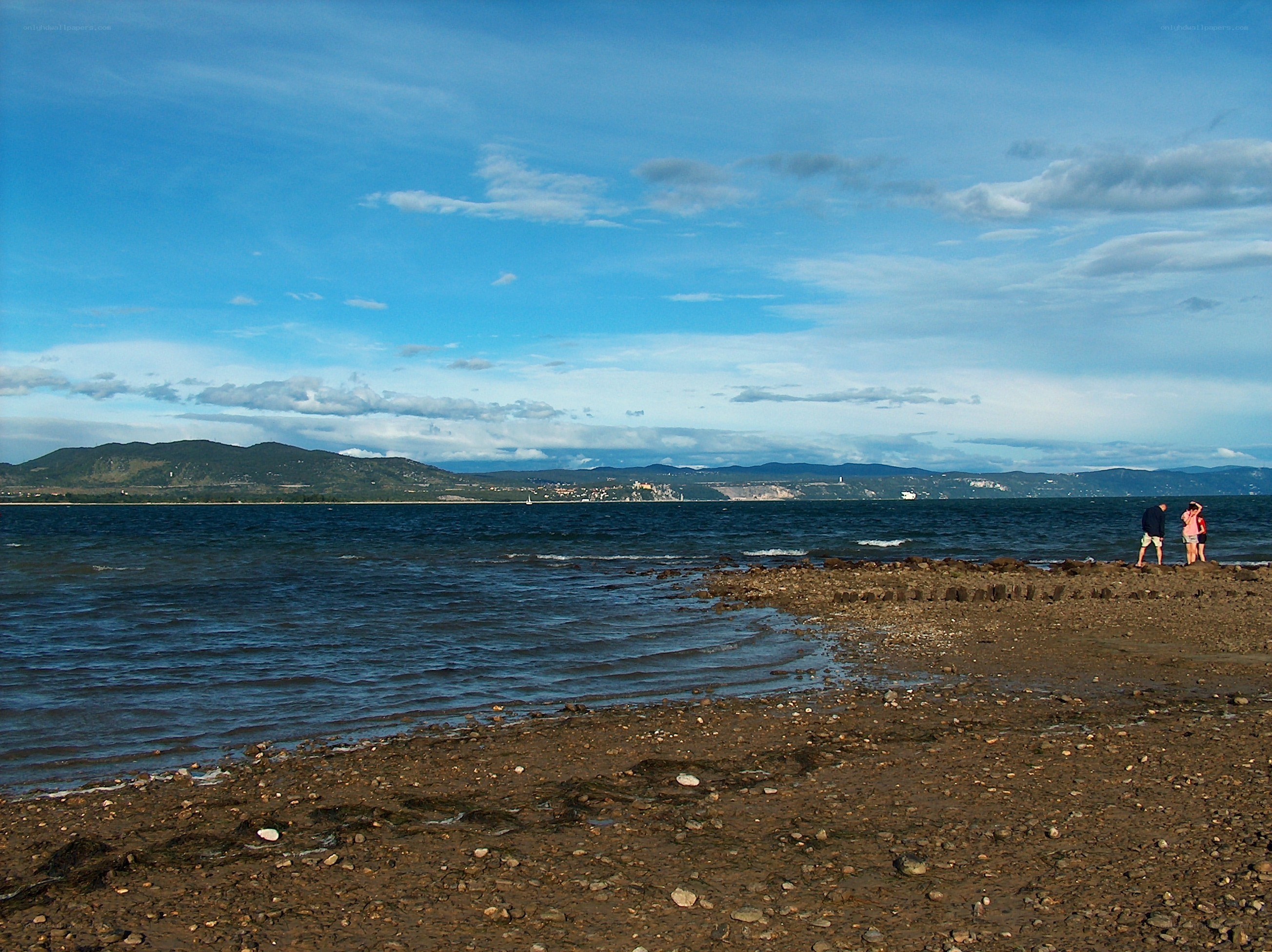 Couple on a rocky beach