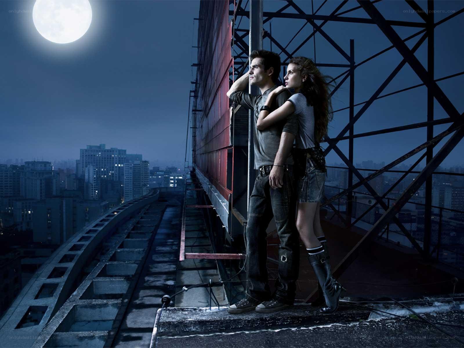 Couple on a rooftop at night
