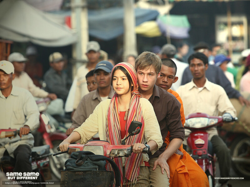 Couple on a scooter in a busy market