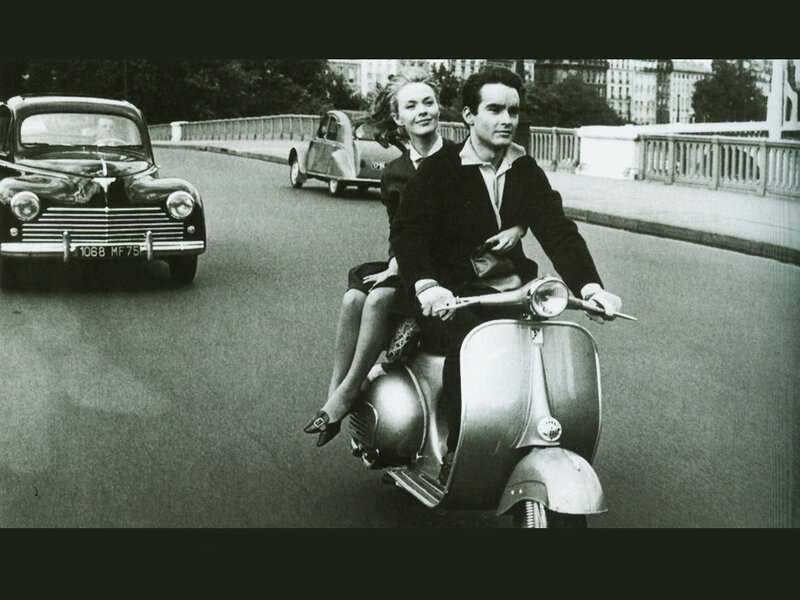 Couple on a scooter in Paris