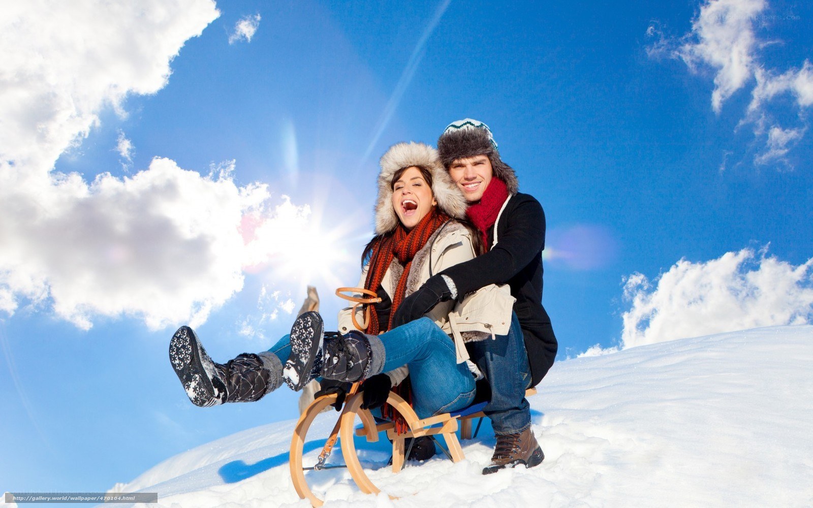 Couple on a sled in snow