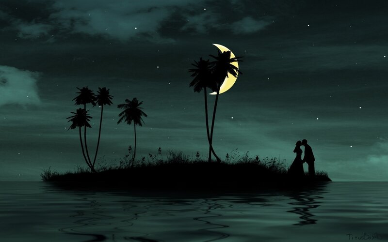 Couple on a tropical island at night