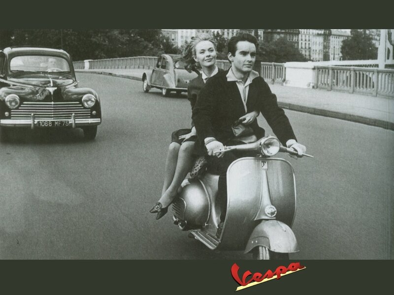 Couple on a Vespa scooter